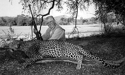 Lynn 'Doc' Greenlee with leopard he took on third day of hunt. Although he loaded the ammo Doc used a .416 to kill the leopard. (Photo by Ken Moberg).